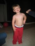 Alex practicing his high kick, Aidan looking awfully calm